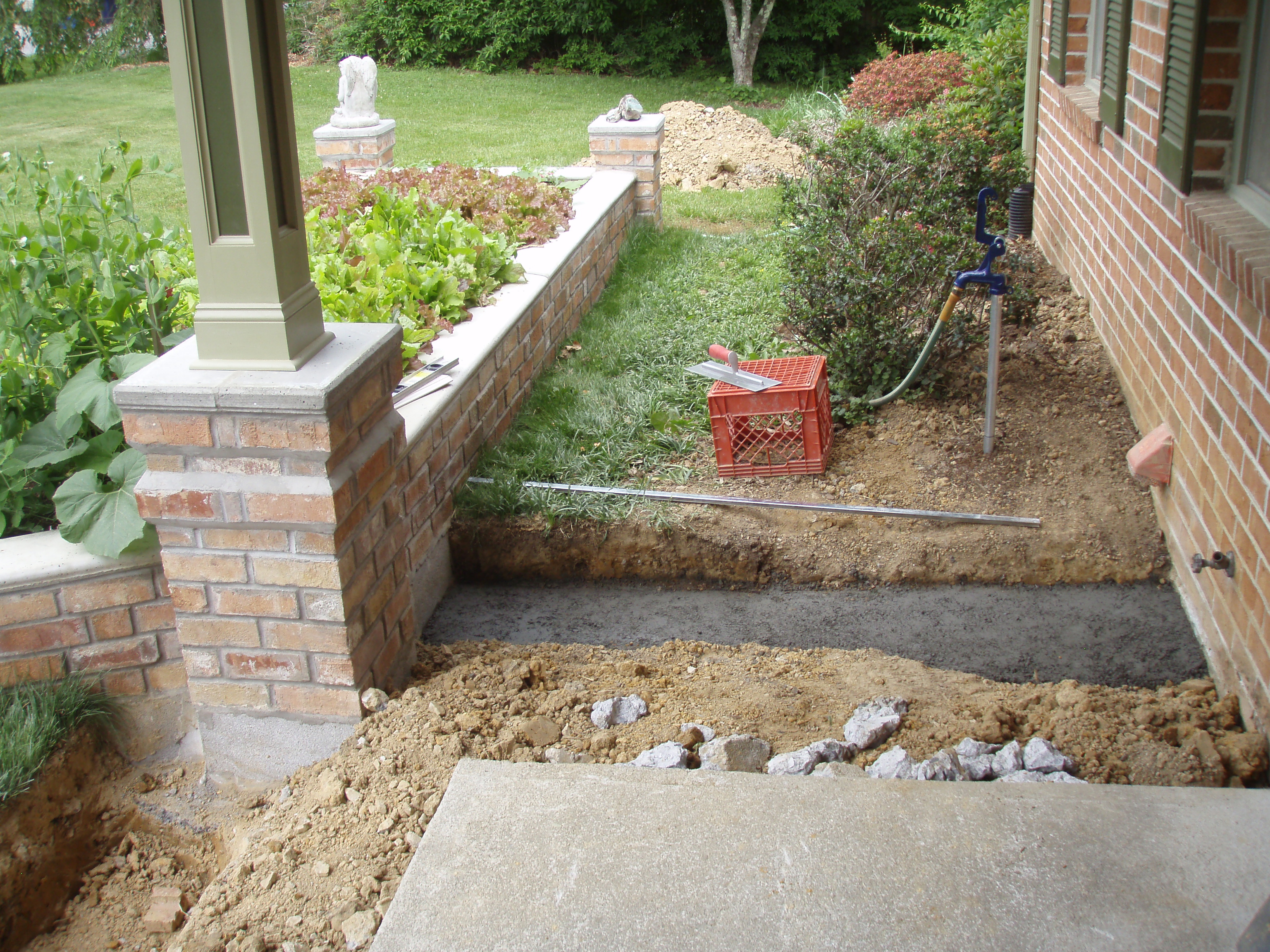 front gable porch with brick raised garden