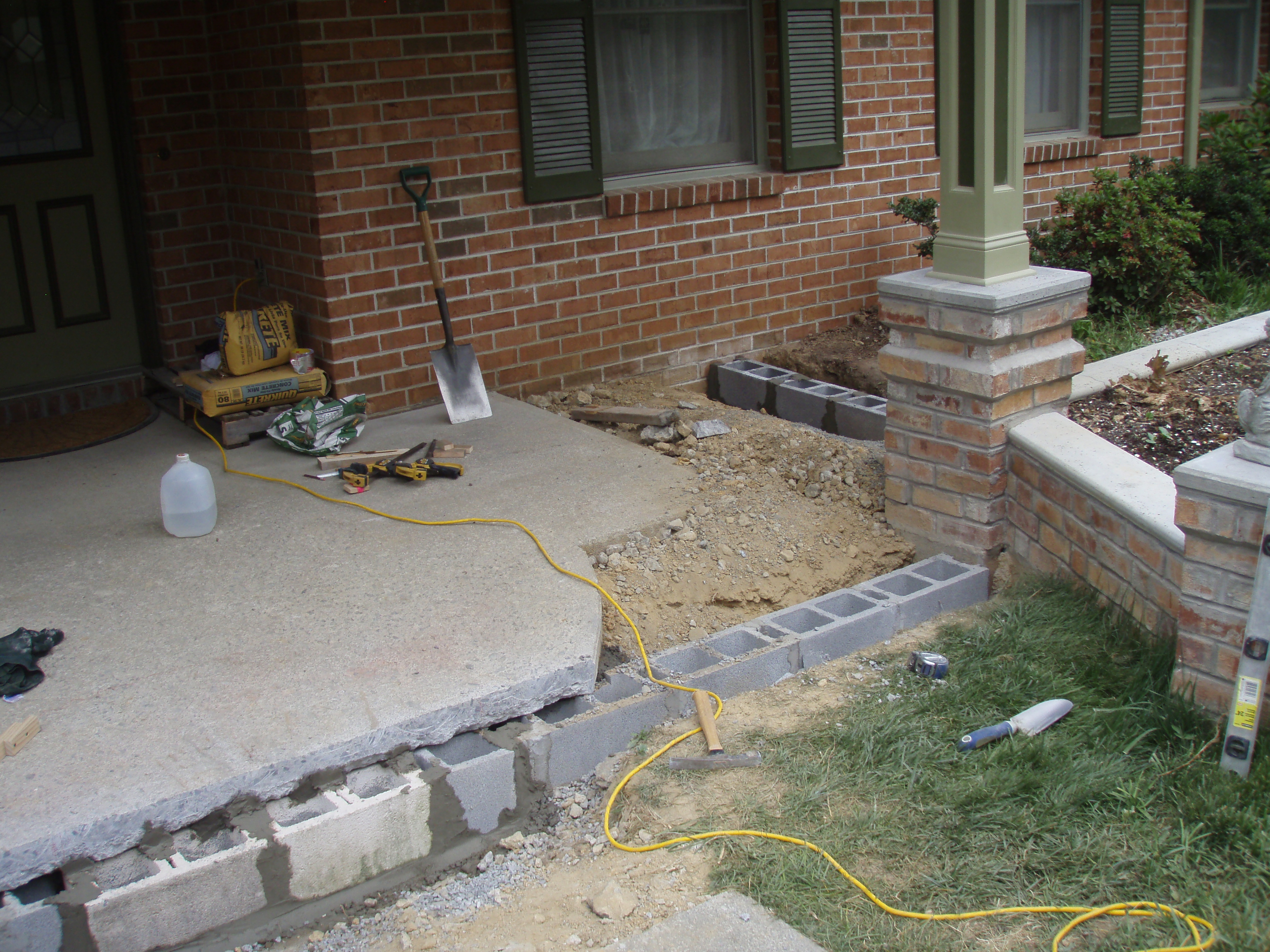 front gable porch with brick raised garden