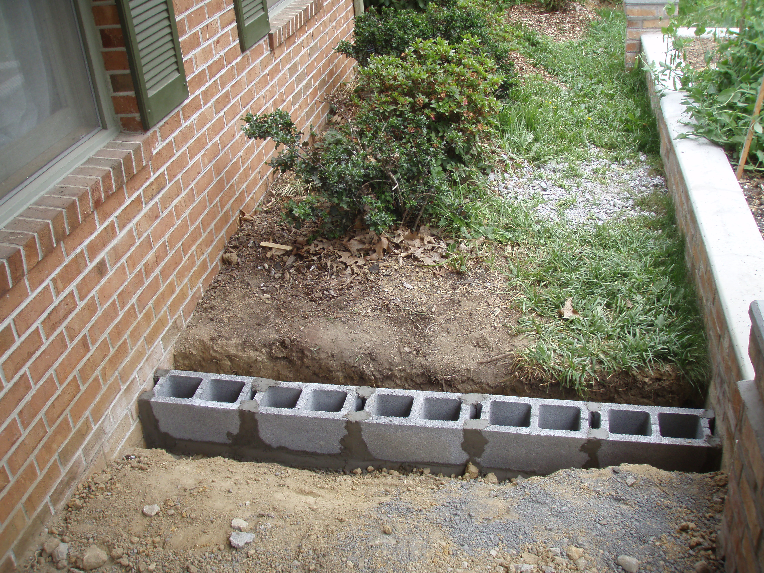 front gable porch with brick raised garden