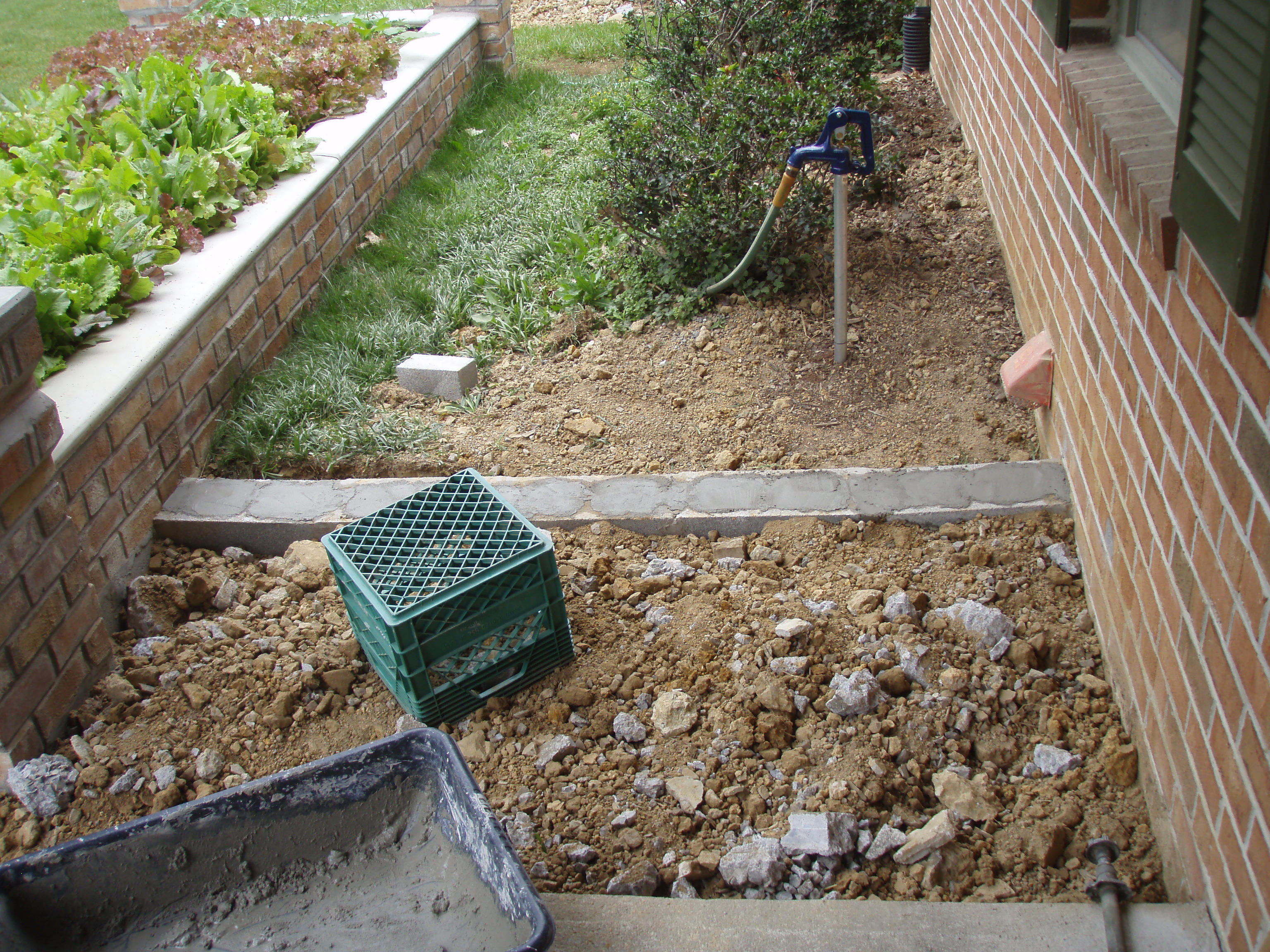 front gable porch with brick raised garden