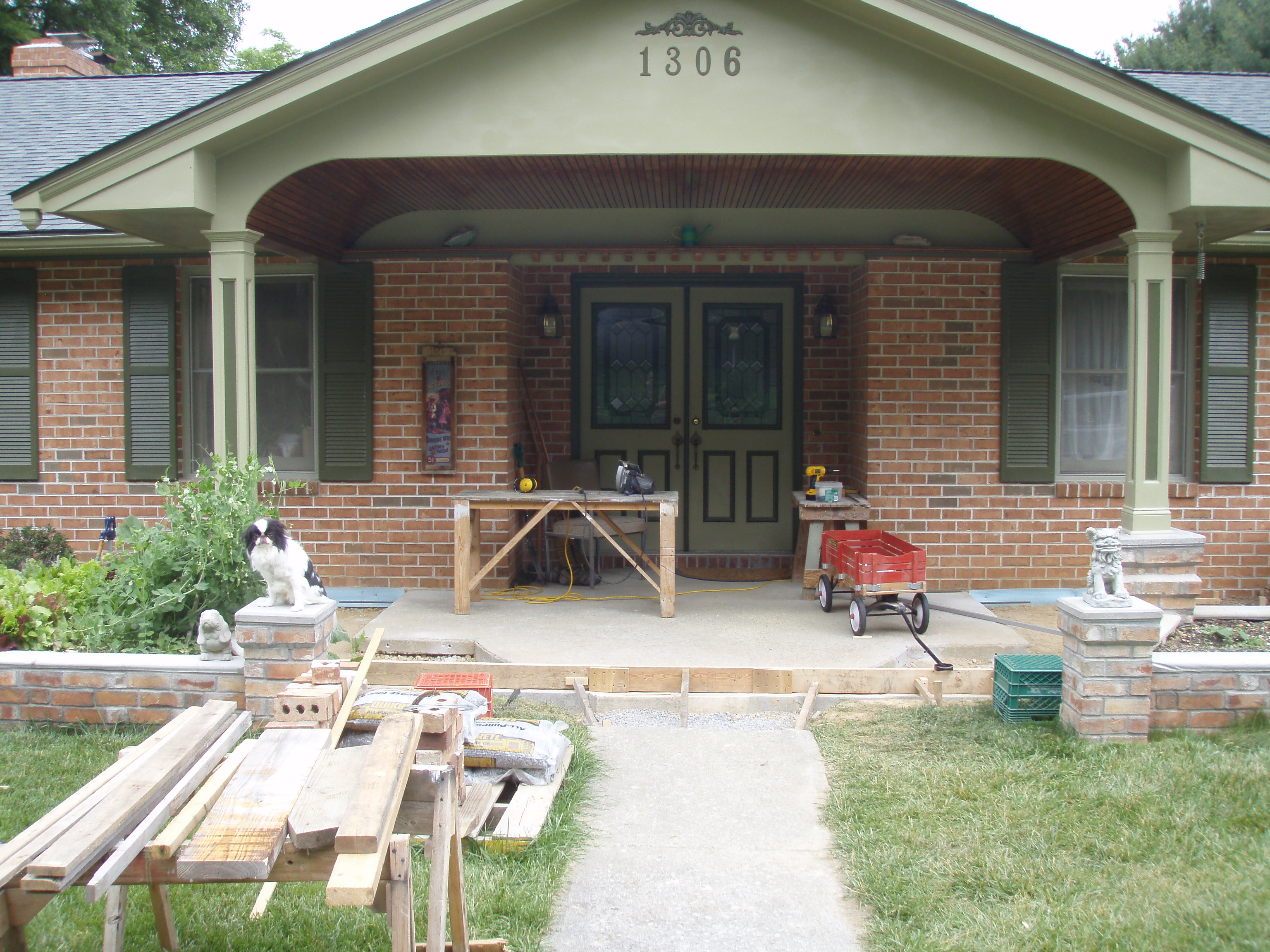 front gable porch with brick raised garden