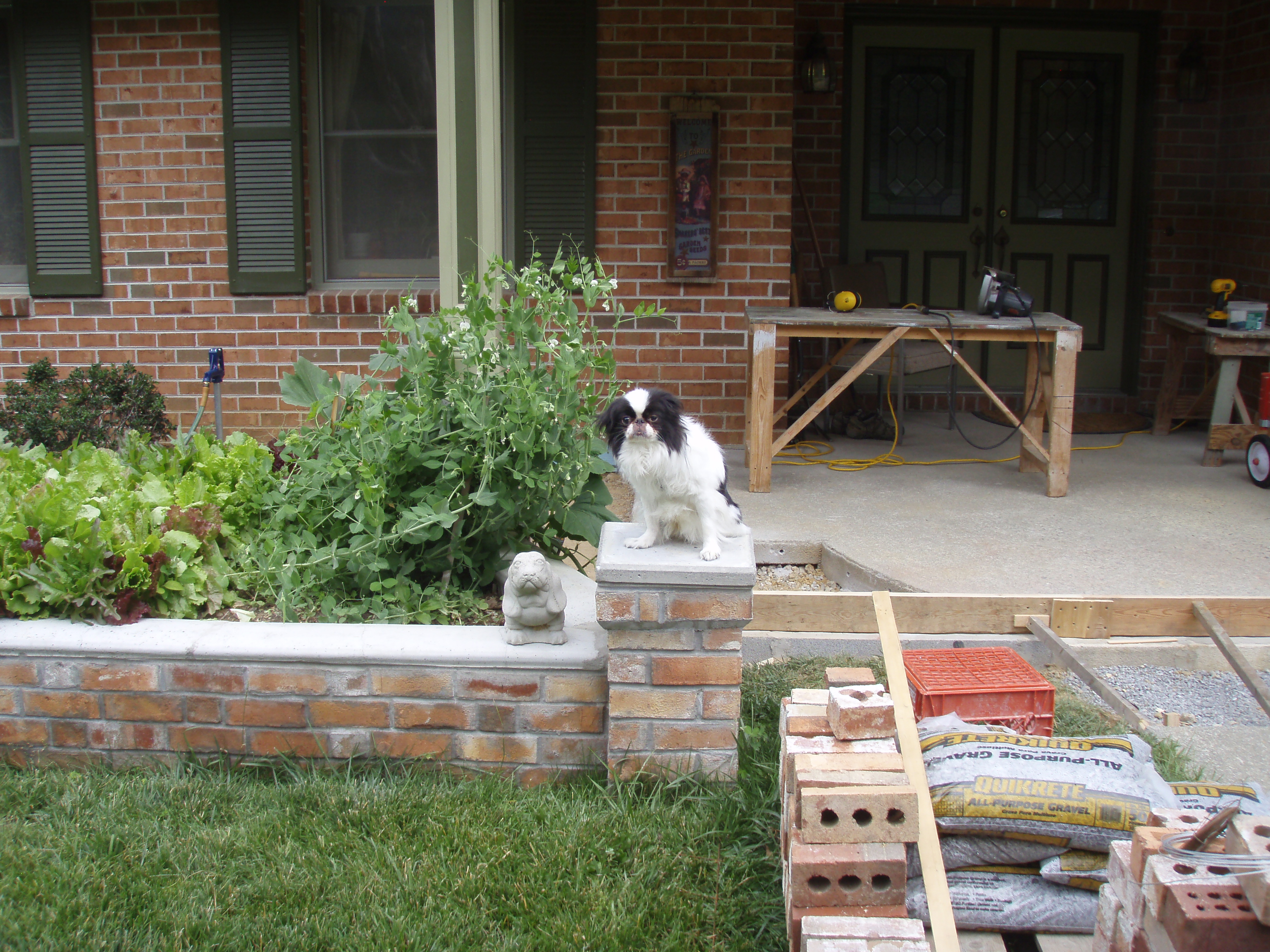 front gable porch with brick raised garden