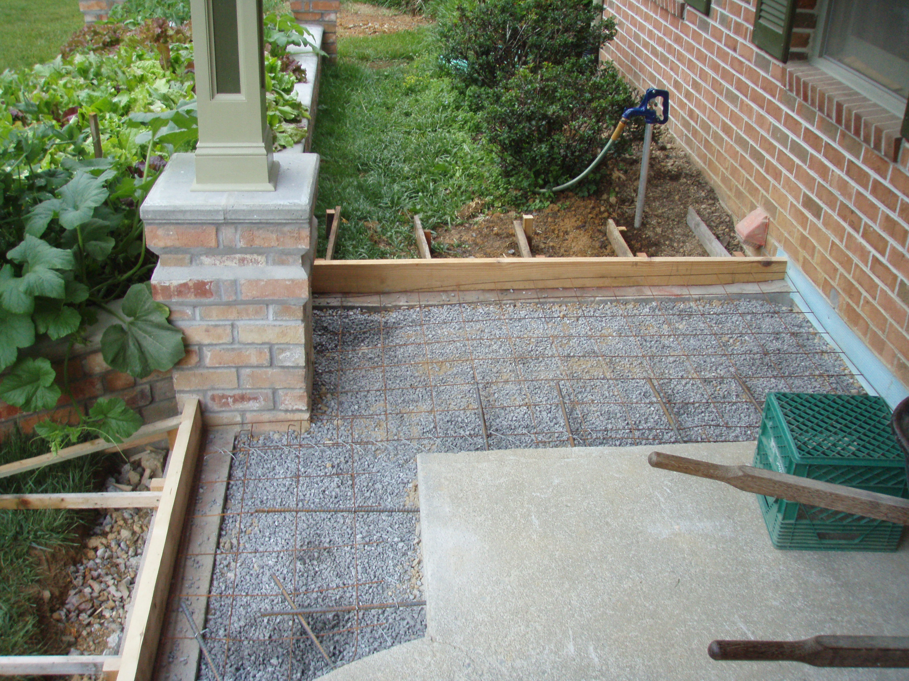 front gable porch with brick raised garden