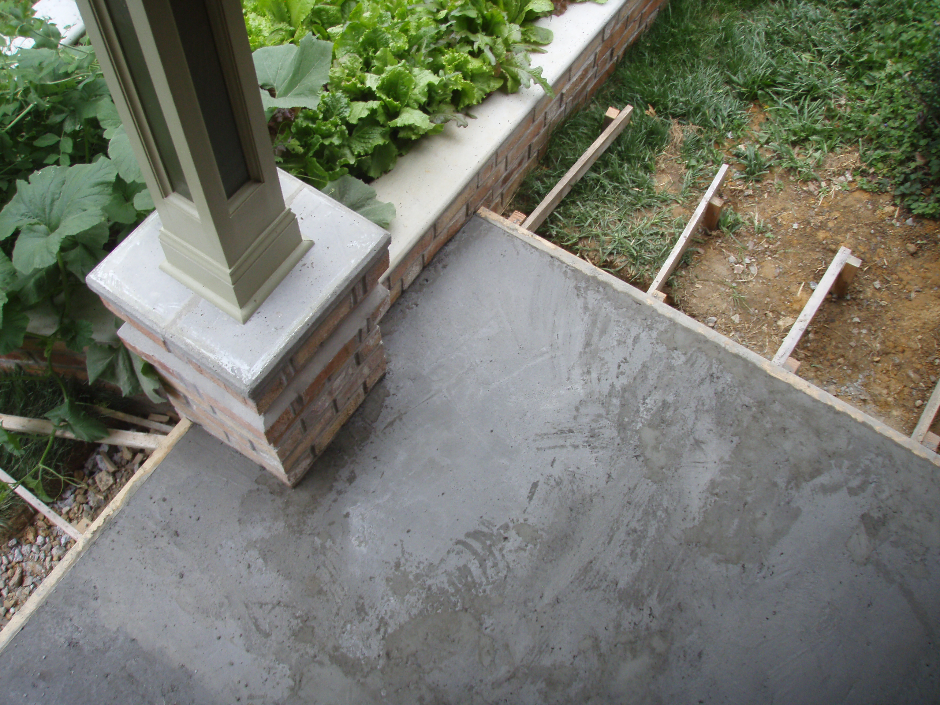 front gable porch with brick raised garden