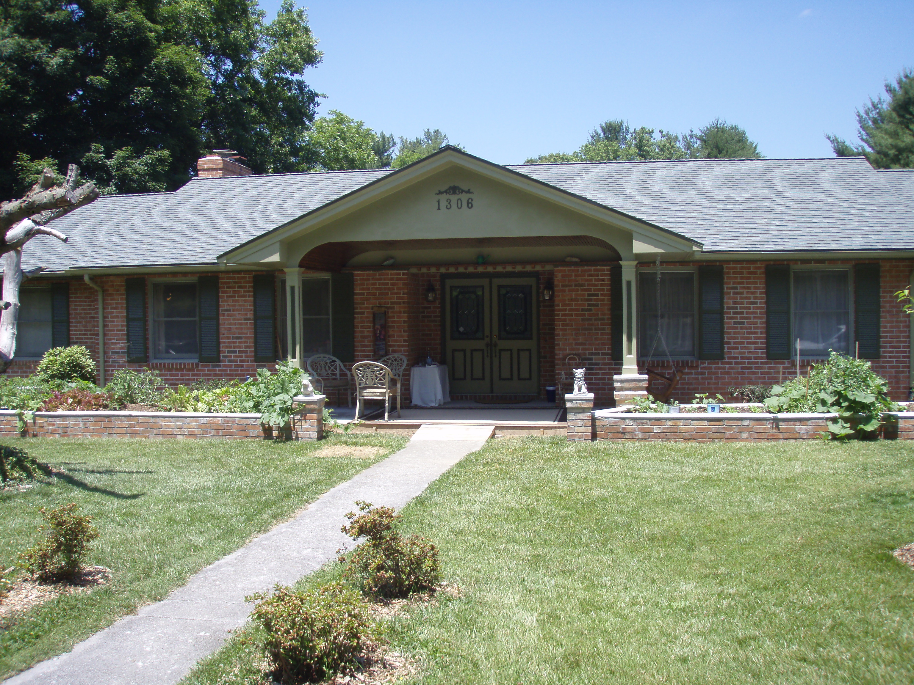 front gable porch with brick raised garden