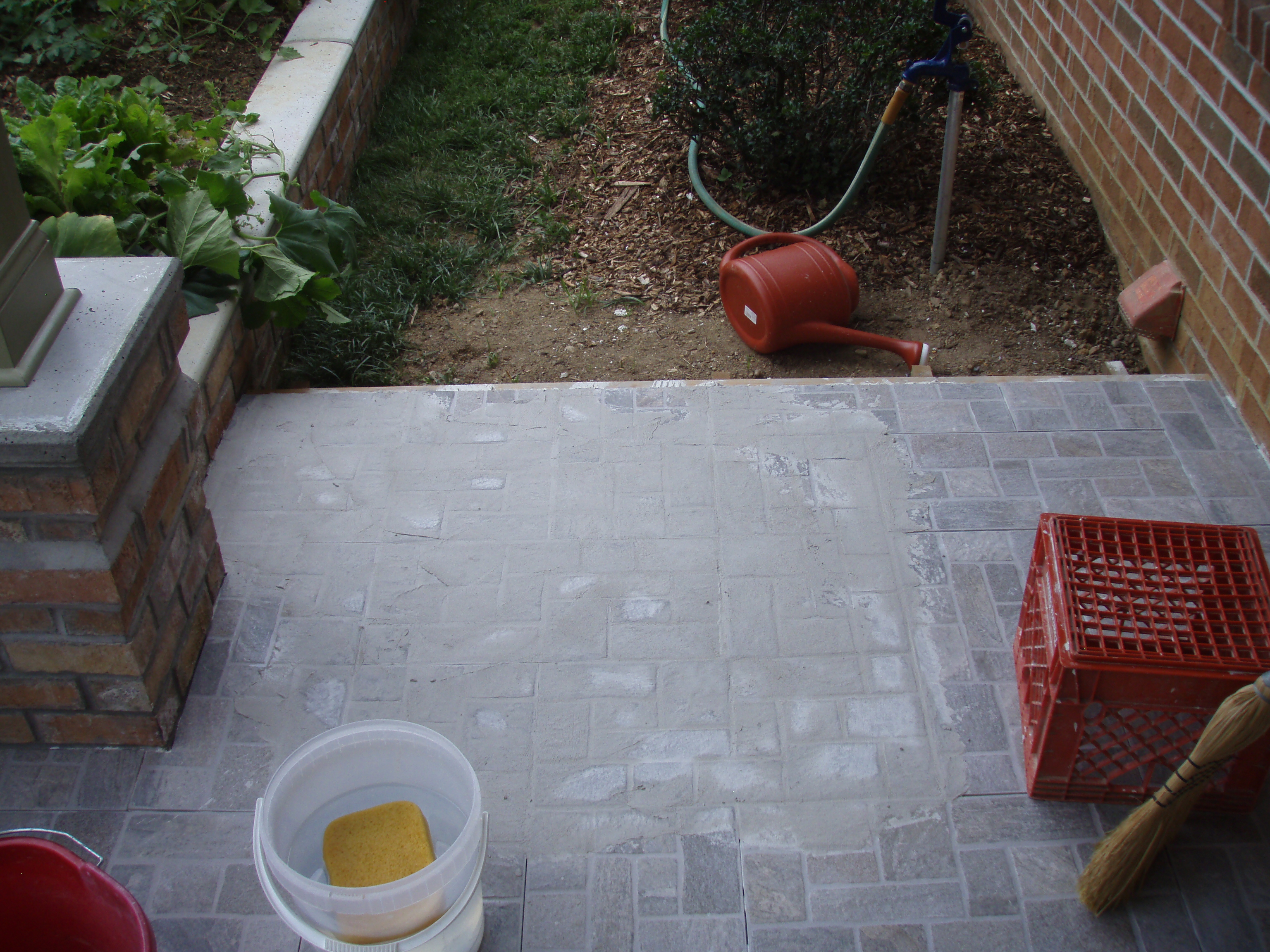 front gable porch with brick raised garden