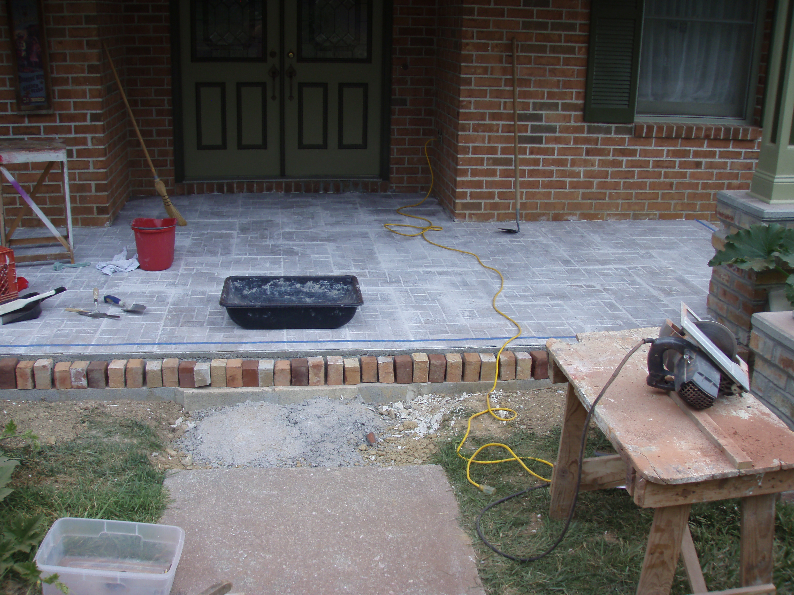 front gable porch with brick raised garden