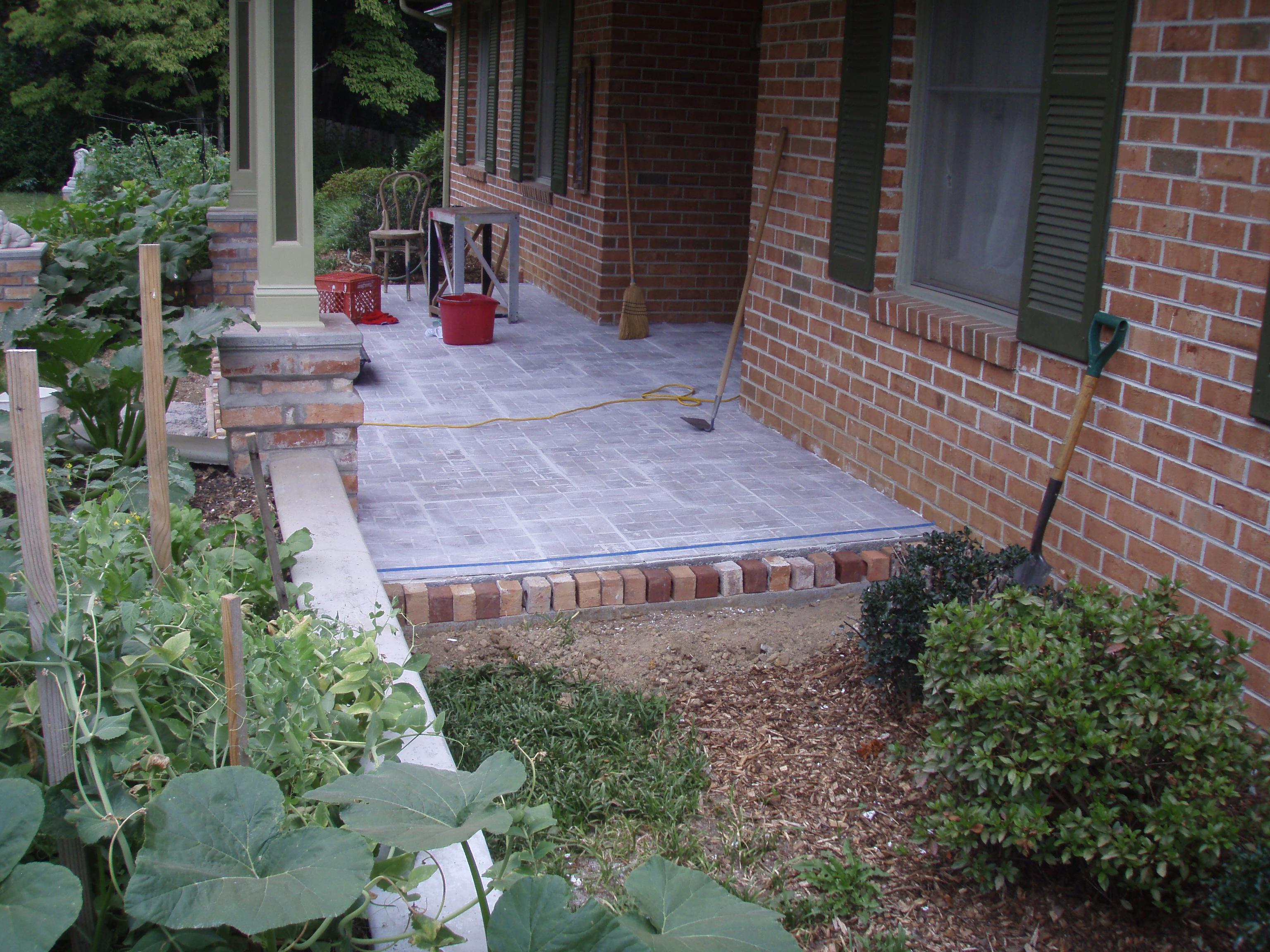 front gable porch with brick raised garden