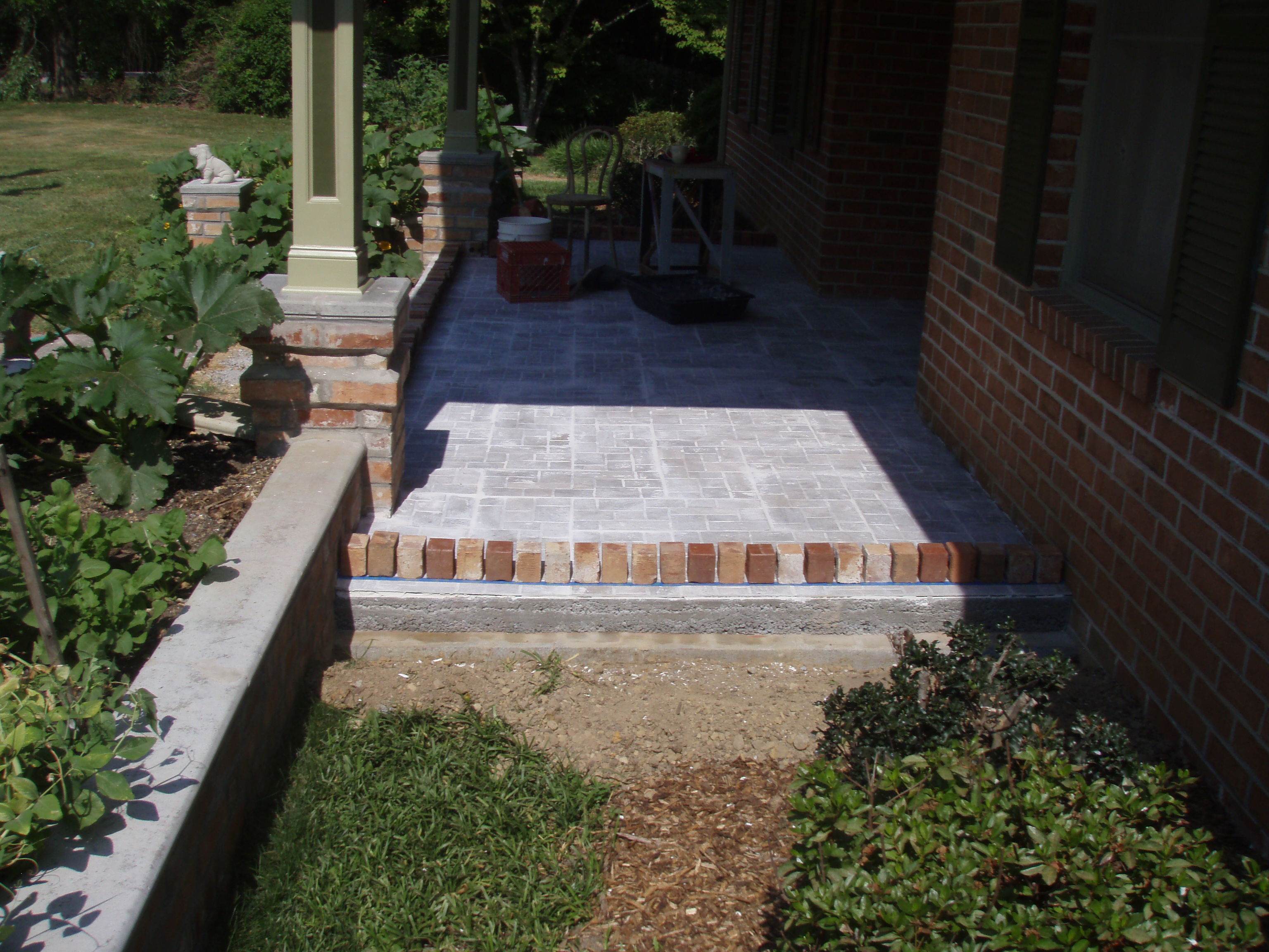 front gable porch with brick raised garden