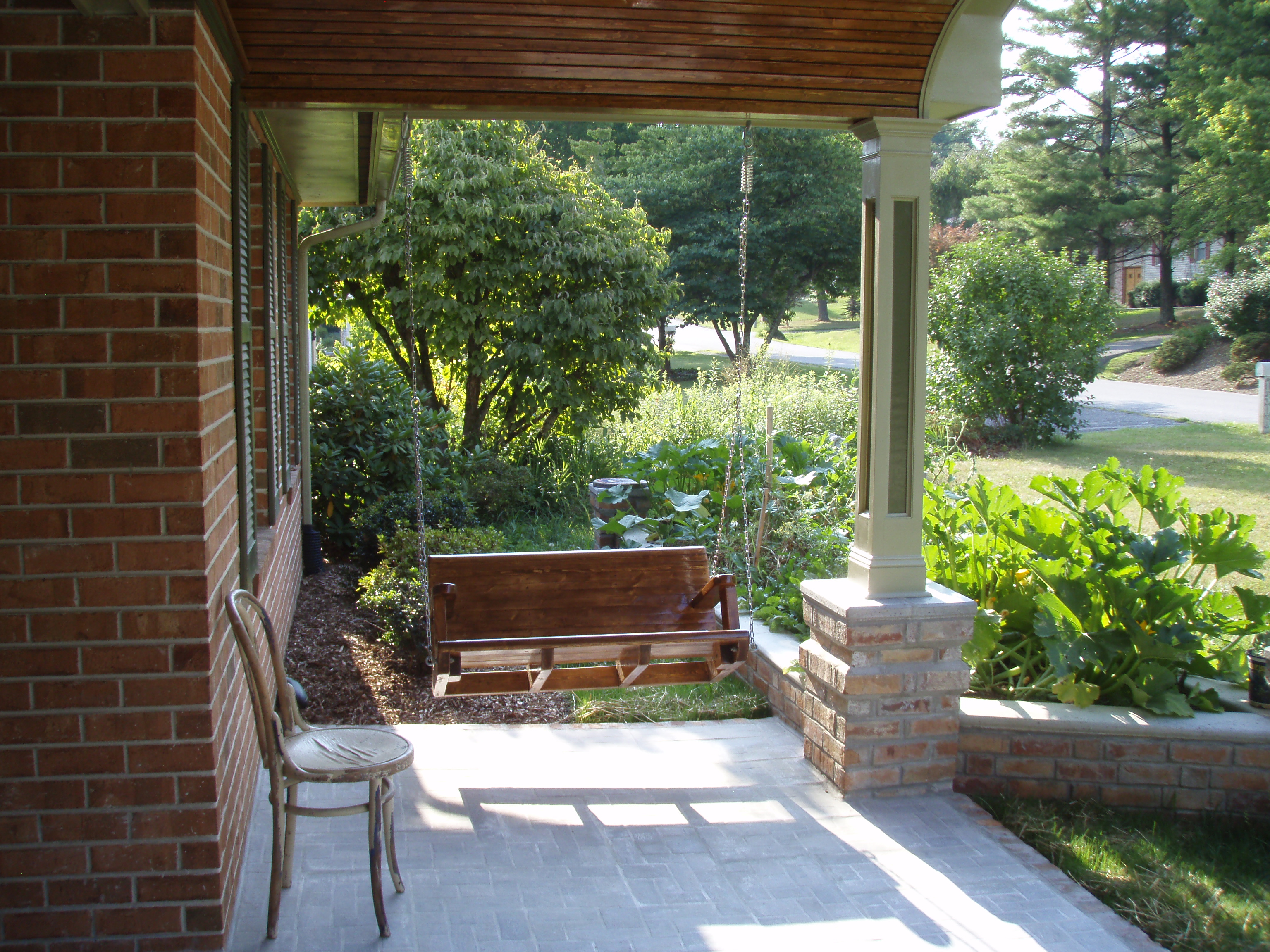 front gable porch with brick raised garden