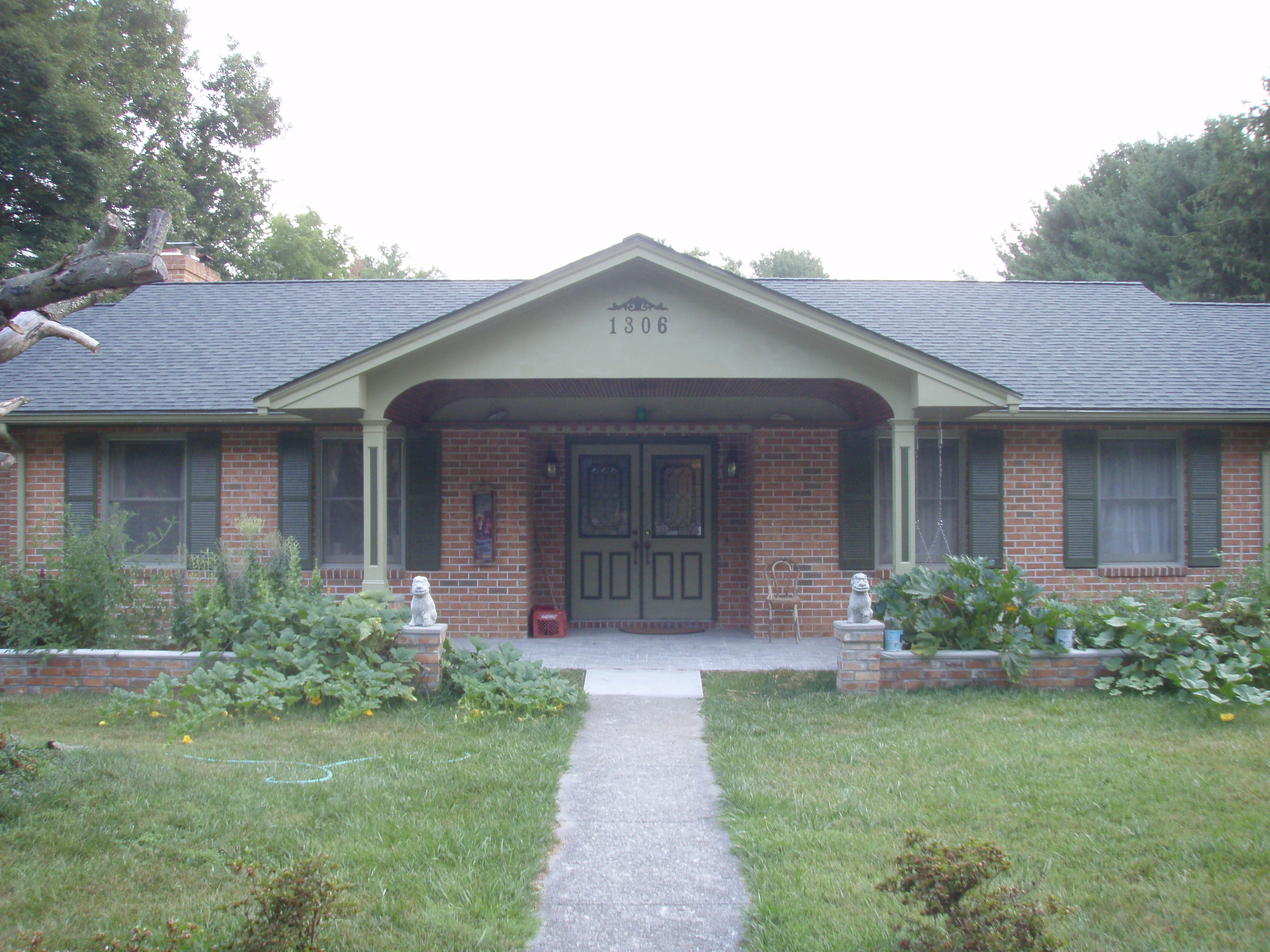 front gable porch with brick raised garden