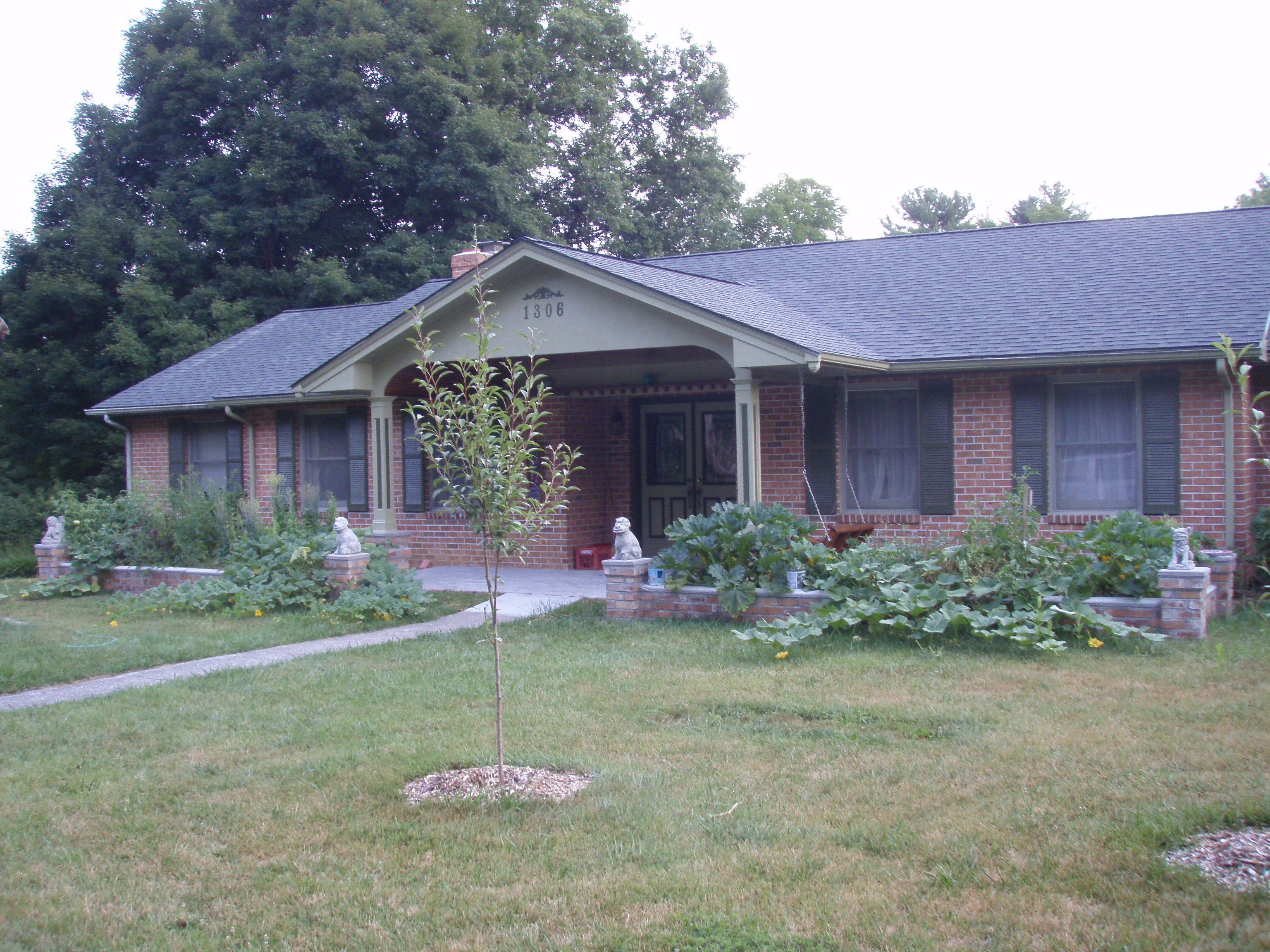 front gable porch with brick raised garden