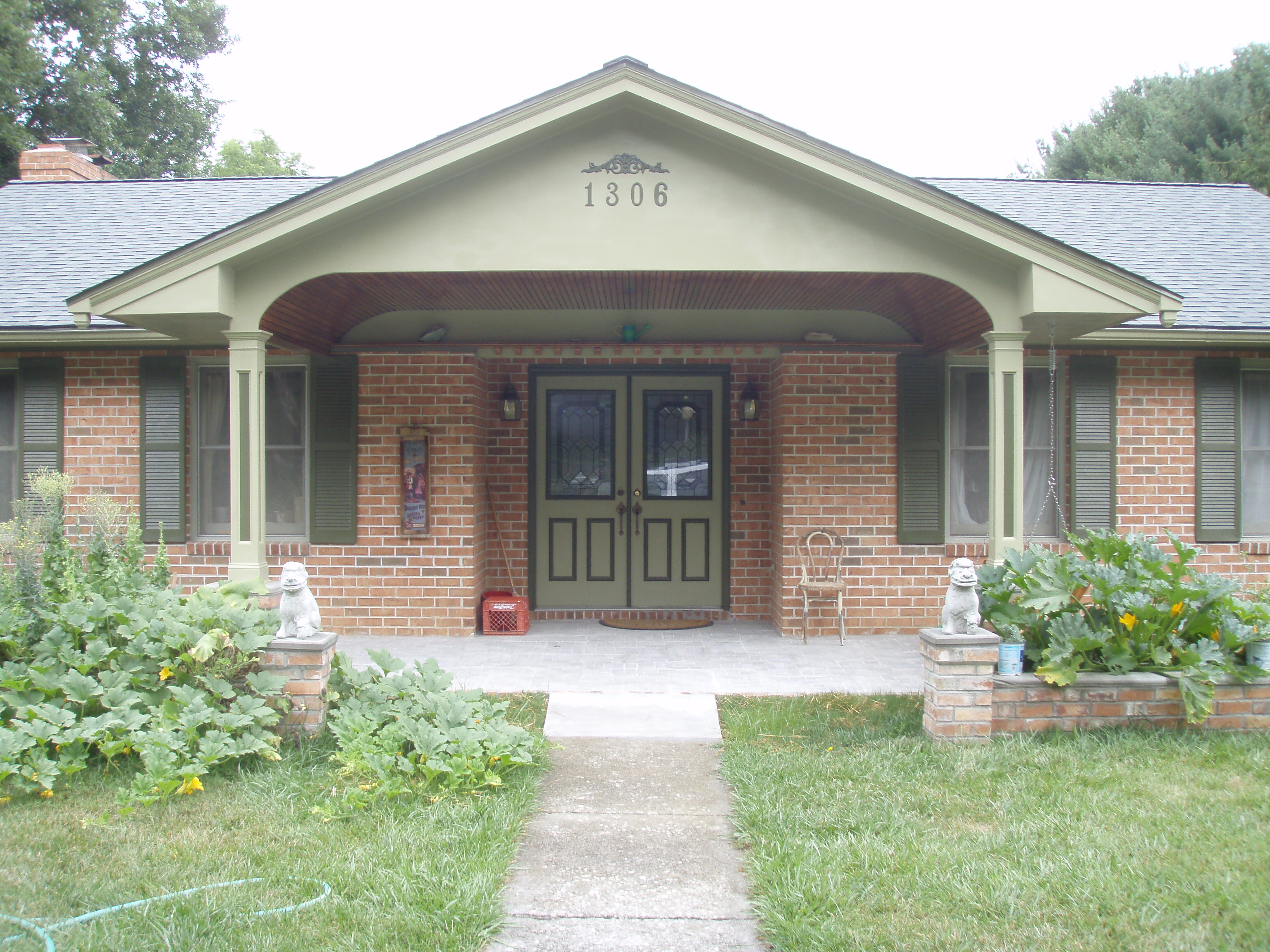 front gable porch with brick raised garden