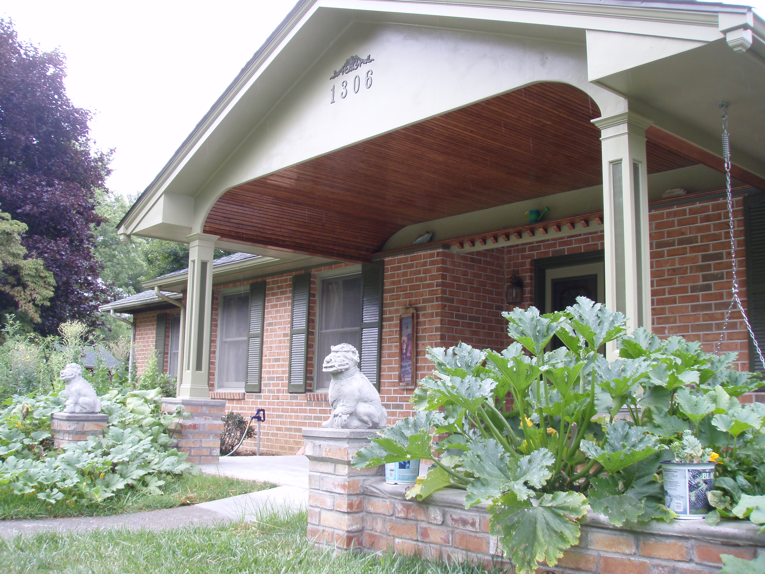 front gable porch with brick raised garden