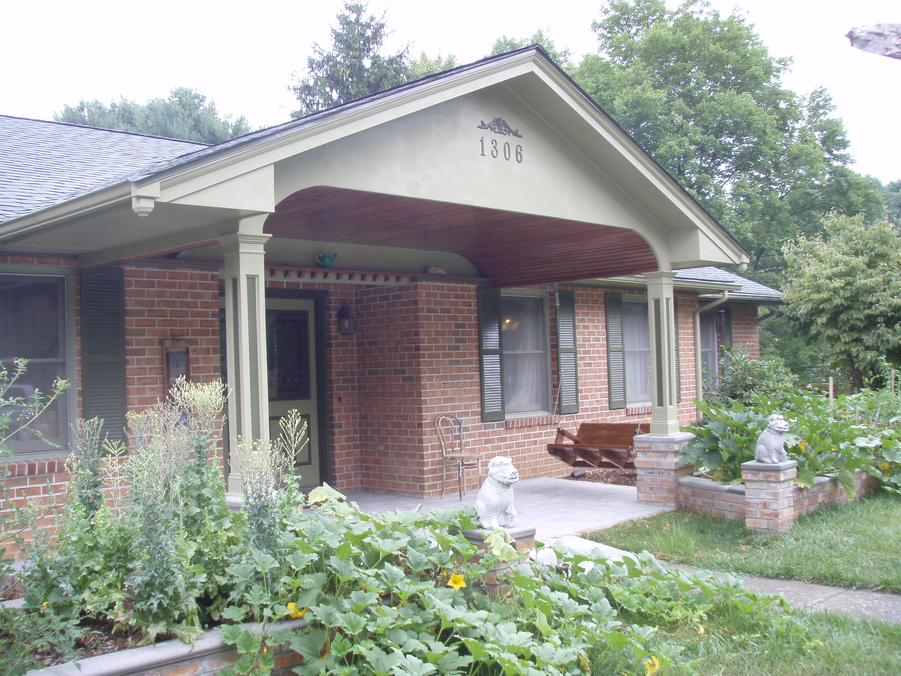 front gable porch with brick raised garden