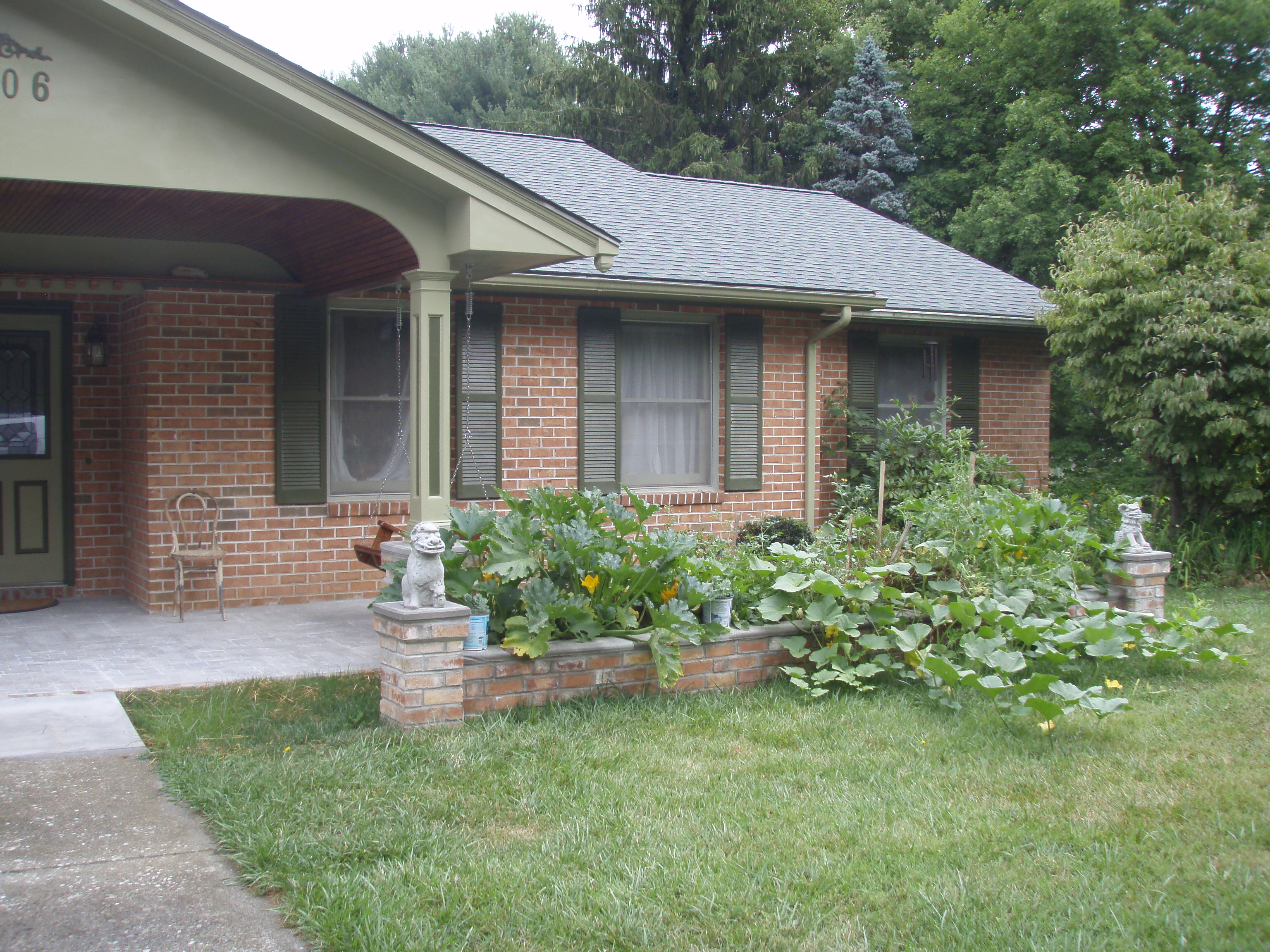 front gable porch with brick raised garden