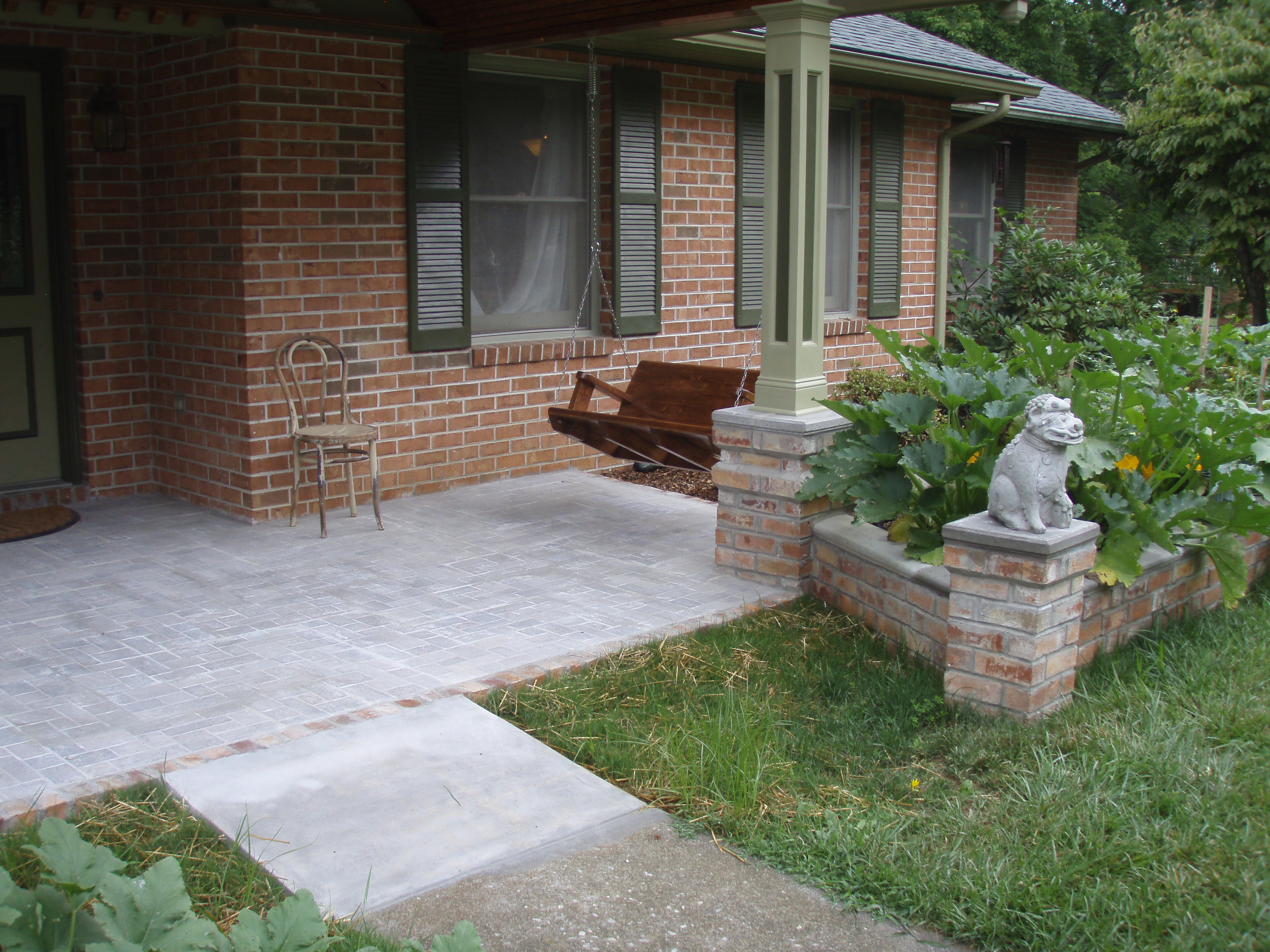 front gable porch with brick raised garden