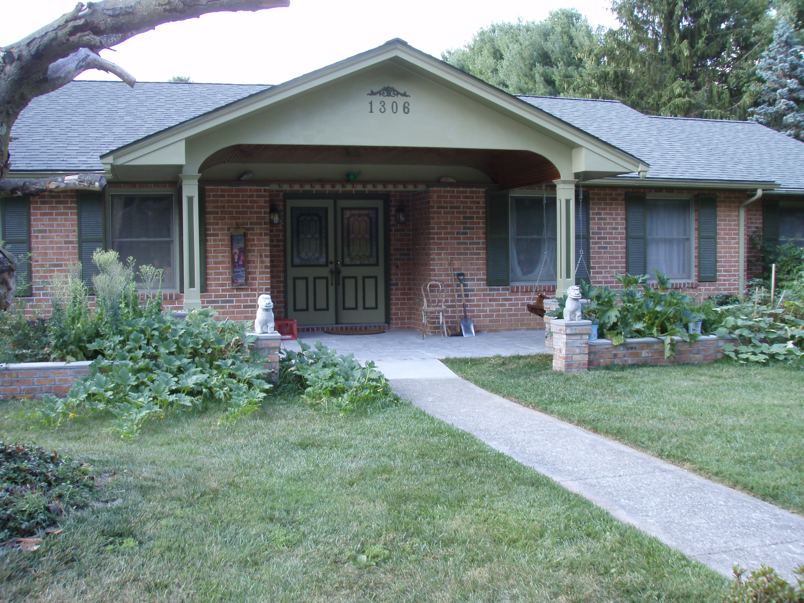 front gable porch with brick raised garden