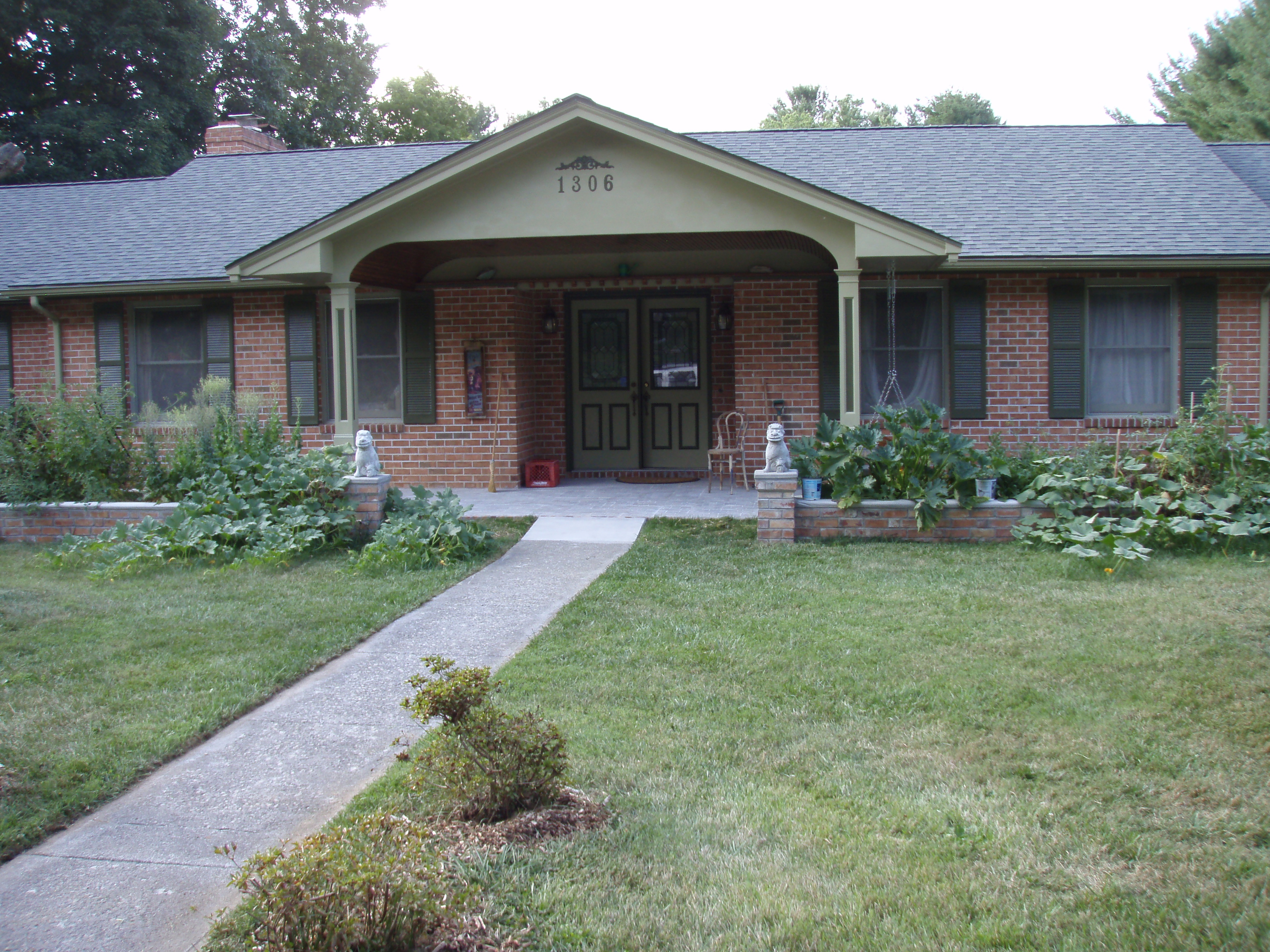 front gable porch with brick raised garden