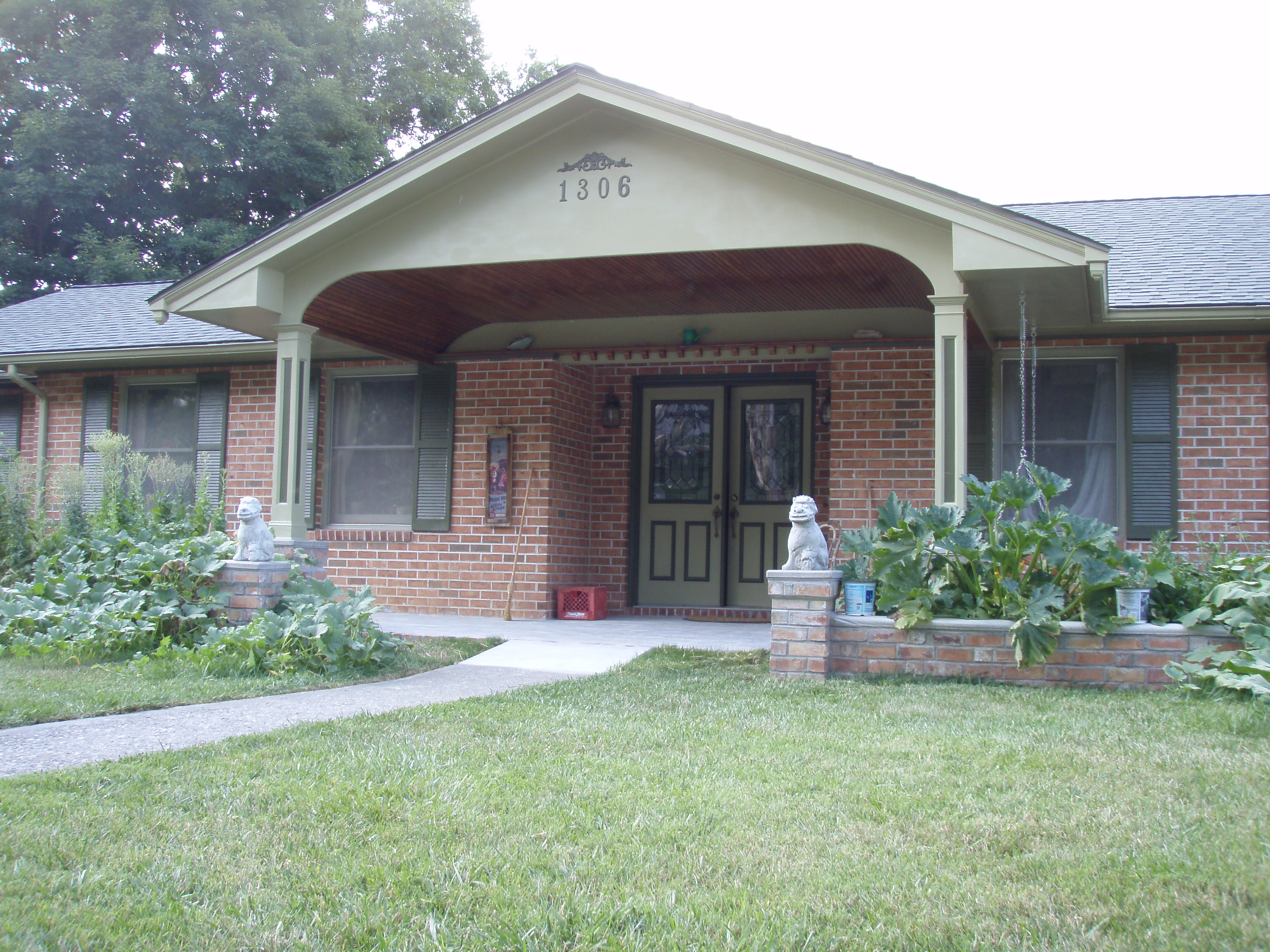 front gable porch with brick raised garden